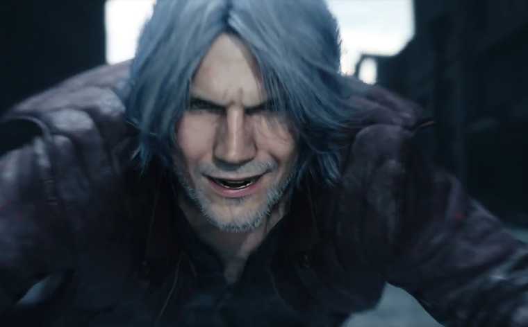 Screenshot from E3 2018's Devil May Cry 5 trailer by Capcom. Close up of grizzled, older male character, smiling maniacally.