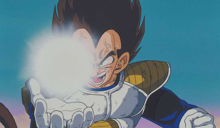 Vegeta channels bright, glowing energy in his palm