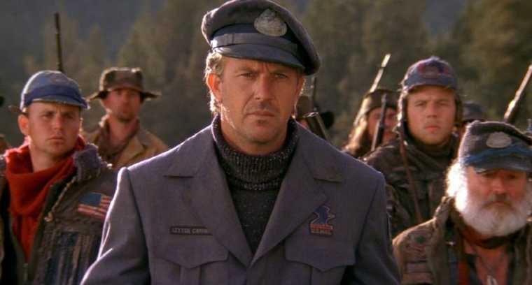 Screen from The Postman (1997) featuring Kevin Costner wearing US Postal Service uniform.