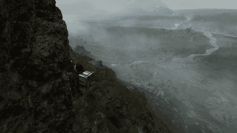 Death Stranding screen capture - Norman Reedus' character climbing a cliff-face