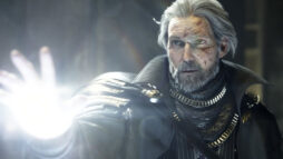 Screen capture from Final Fantasy XV Kingsglaive. King Regis reaches out, his hand glowing.