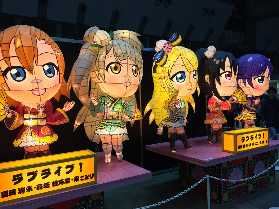 Photo of large paper lanterns in the shape of "Love Live!" characters, from the convention floor at Anime Expo 2016.