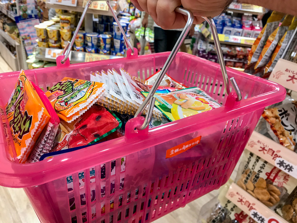 A shopping basket full of Japanese sweets and snacks