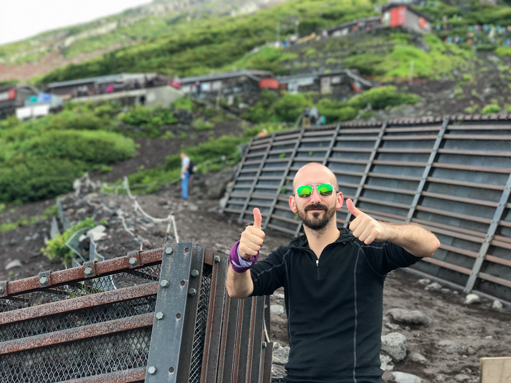 Bryan McDowall, posing with two thumbs up, outside the 7th station on Mt Fuji, in August.