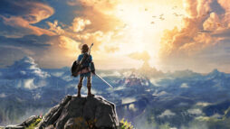 Promotional screen from Zelda: Breath of the Wild. Protagonist (Link) with sword and shield, stands on a cliff peak looking towards the sun.