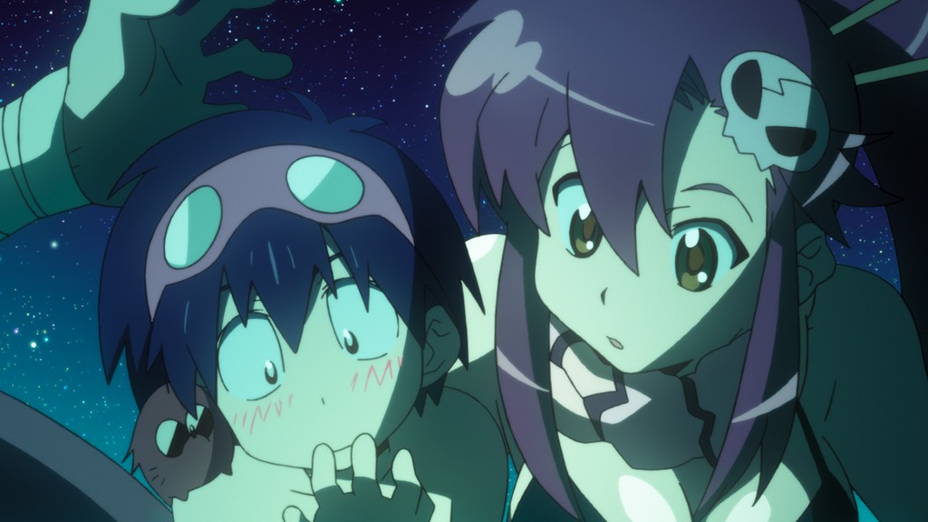 Young boy (Simon) and woman (Yoko) look at a glowing object