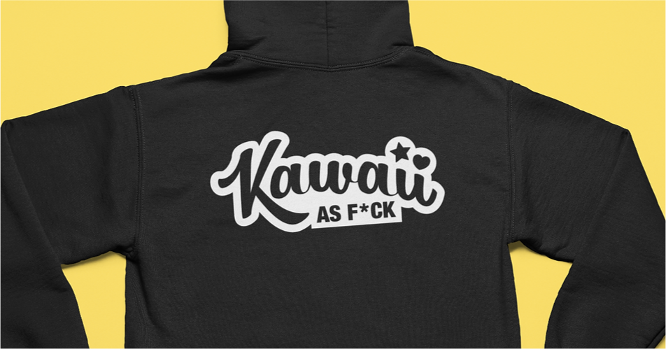 Back of a black hooded sweater on yellow background. Logo in white with cursive typeface reads Kawaii as F*ck.