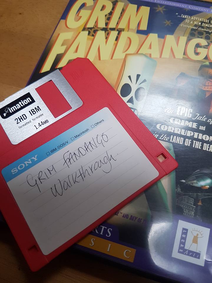 Floppy disc with text Grim Fandango Walkthrough on top of the Grim Fandango PC game box