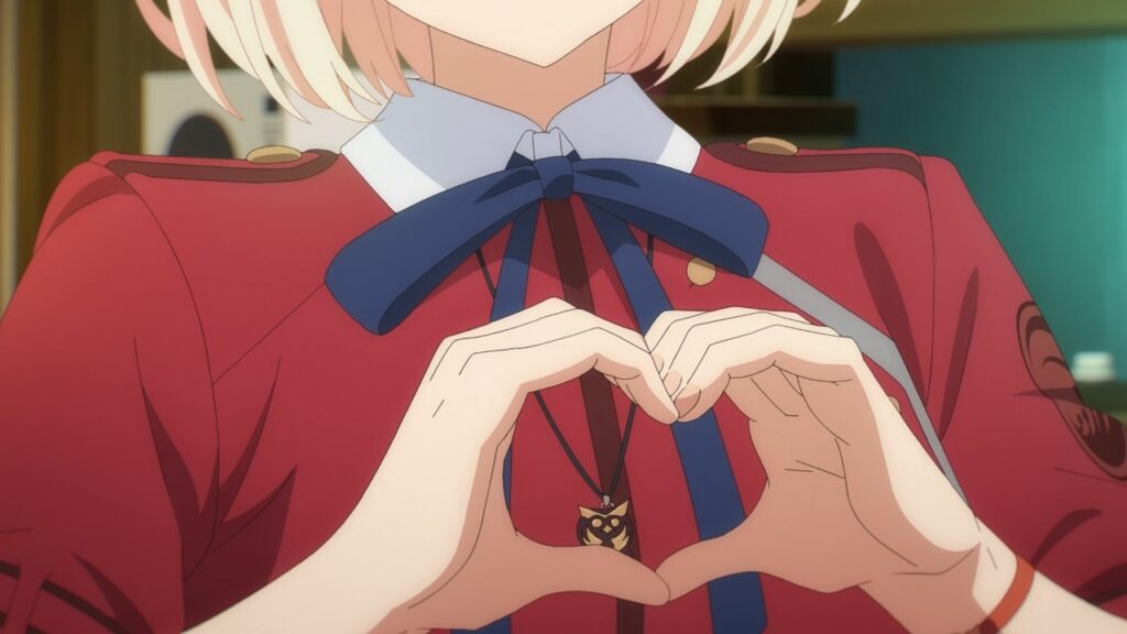 Screen from Lycoris Recoil: Close up of young girl making a heart gesture with her hands.