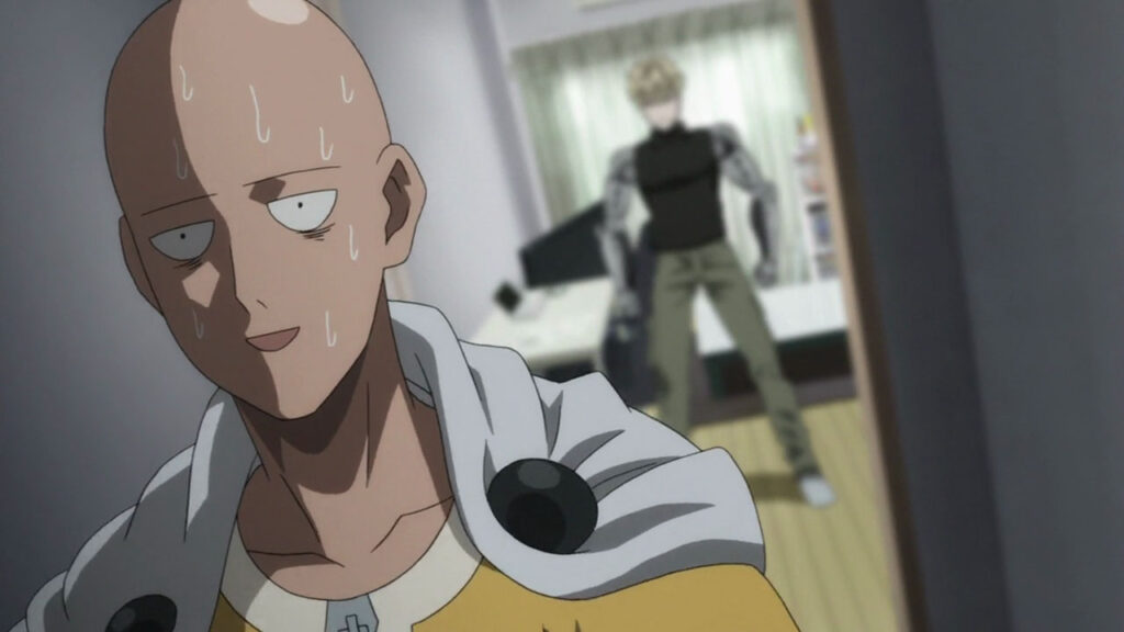 Screen capture from One Punch Man. Bald male protagonist, Saitama, sweating heavily whilst standing in a hallway. Behind him, human cyborg, Genos, appears slightly out of focus.