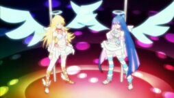 Screen from animation "Panty and Stocking". Two angels (Panty and Stocking) stand in front of poles suggestively, their wings spread.