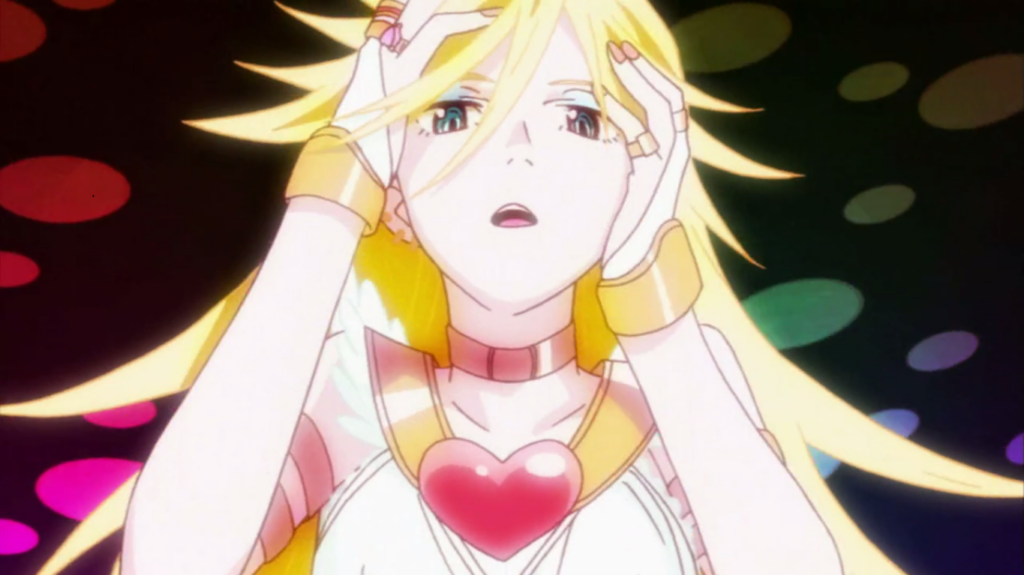 Screen from animation "Panty and Stocking". Close up of blonde female character (Panty), holding her face with her mouth slightly open.