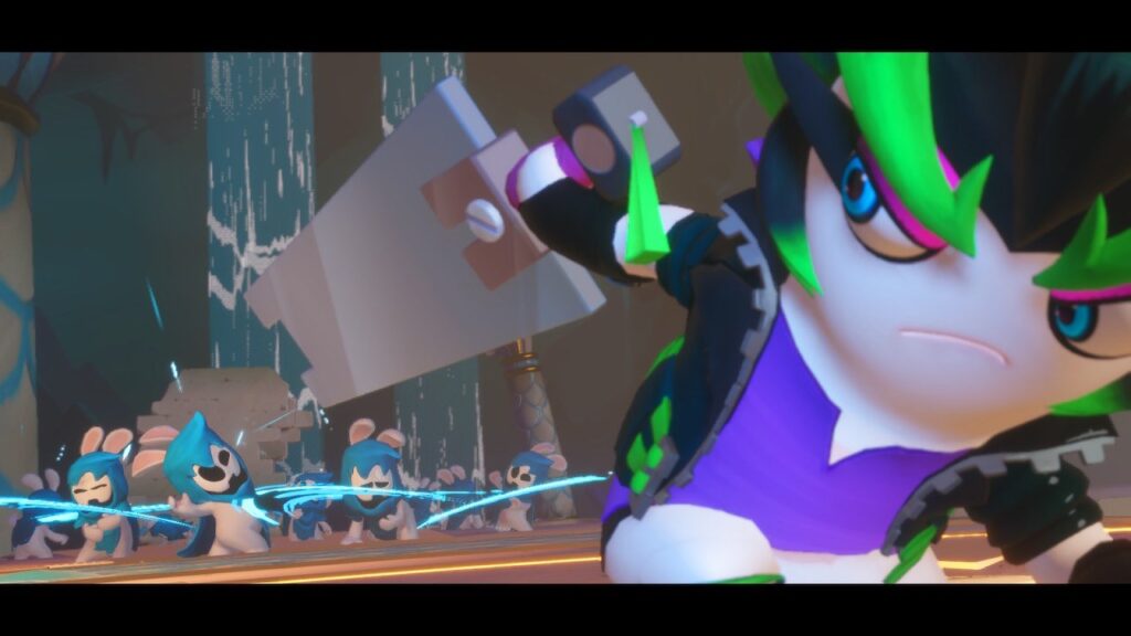 Screen from Mario + Rabbids. Close up of an animated character with large green eyebrows, a leather jacket and a large sword. In the background, several enemies appear to suffer from a simultaneous blade attack.