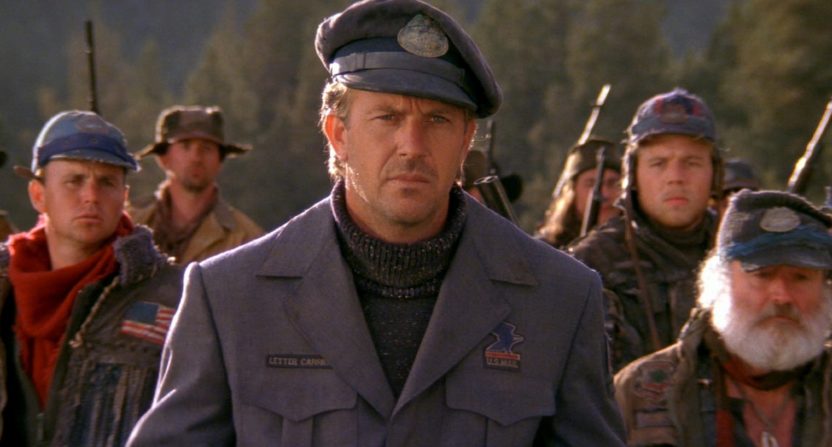 Screen from The Postman (1997) featuring Kevin Costner wearing US Postal Service uniform.