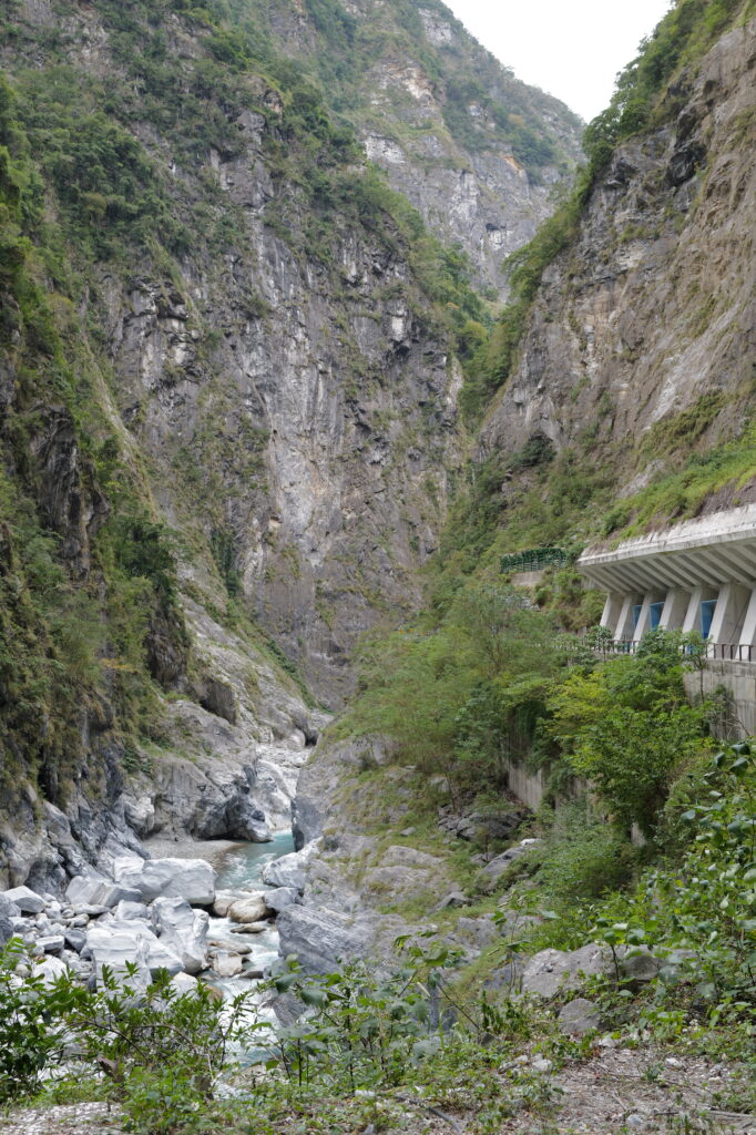 Taroko National Park in January 2024. A lush green valley with a concrete walkway in the side of the mountain.