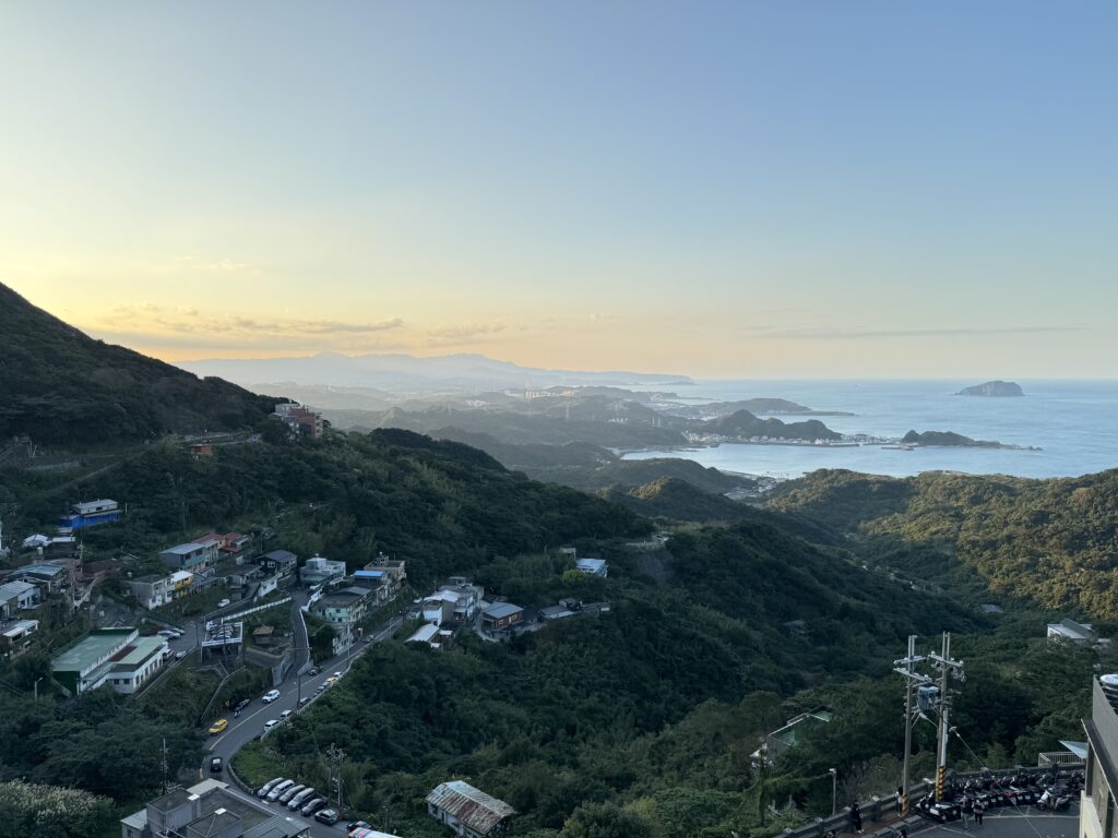 Jioufen from above - looking at the sea during sunset. Green mountains.