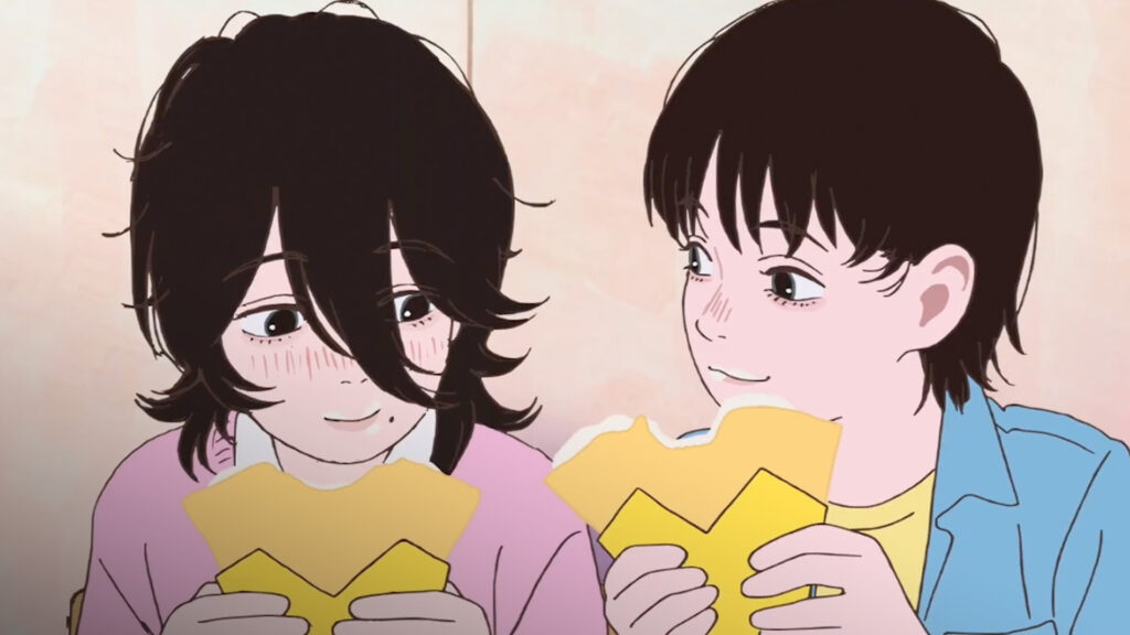 Screen from Look Back. Two young people eating crepes.